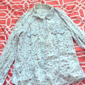 Button down shit or can be worn as a thin jacket